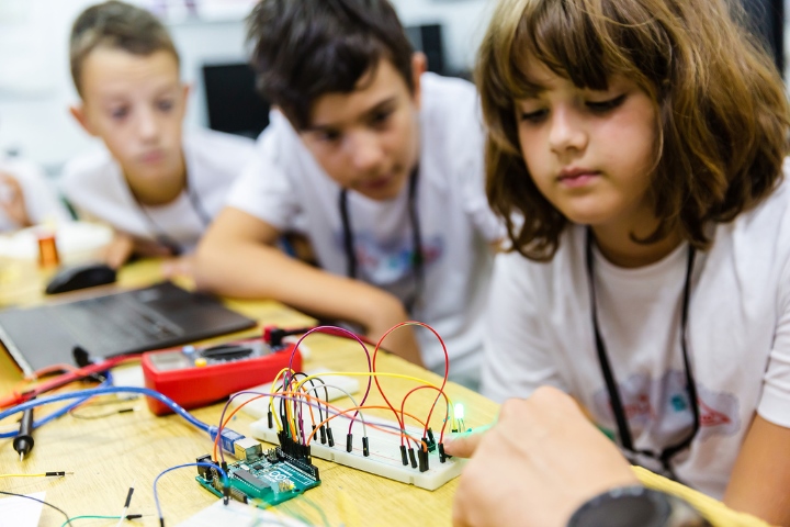 students working on a circuit board