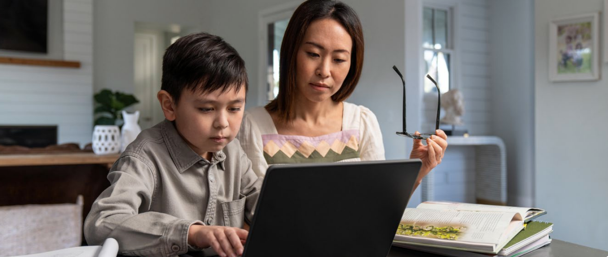 student and parent on a laptop