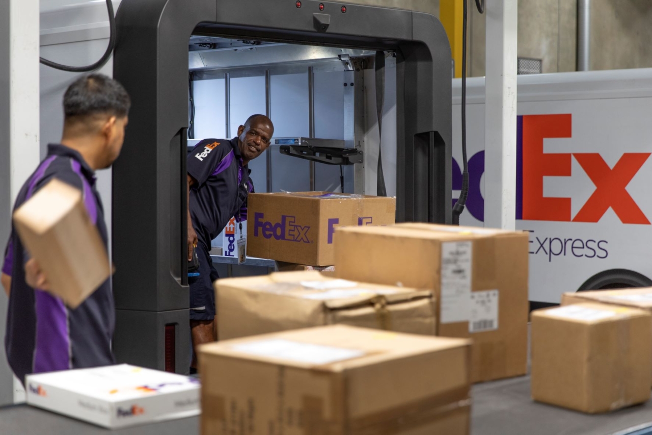 FedEx packages on conveyor belt