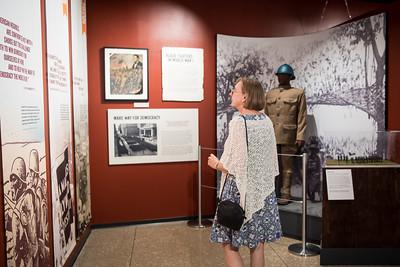 A person viewing museum exhibits.