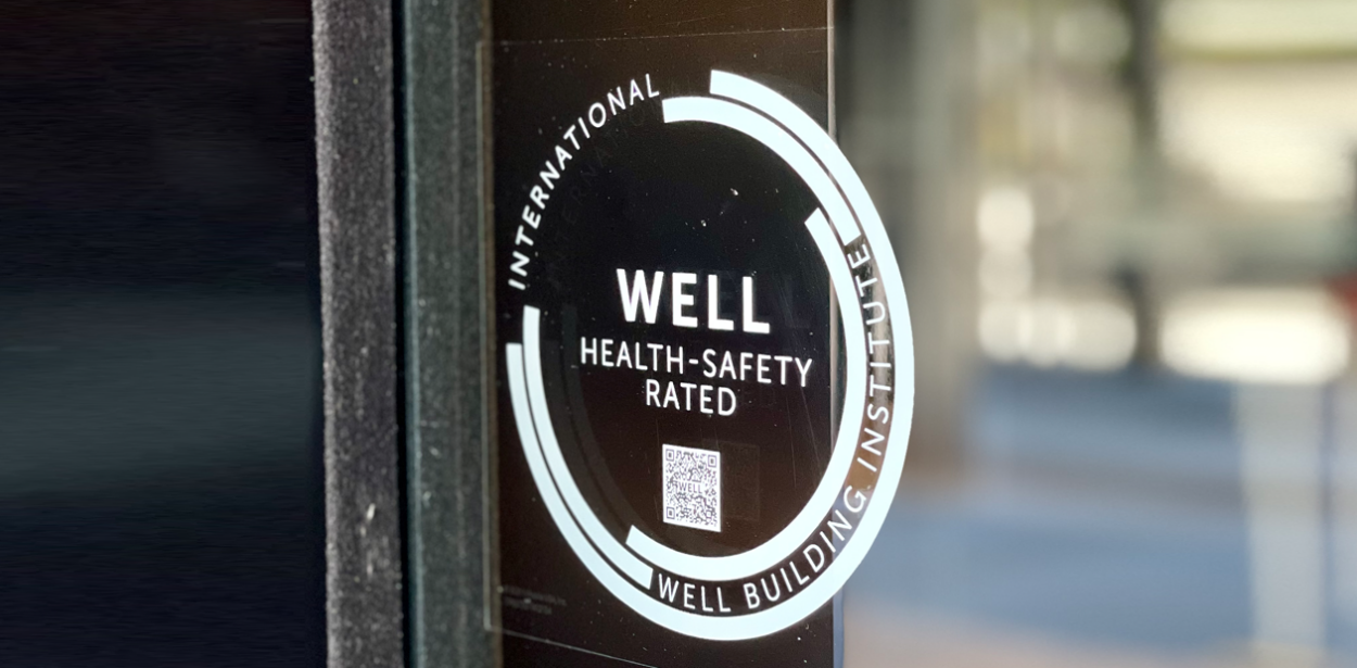 WELL health-safety rated logo on door