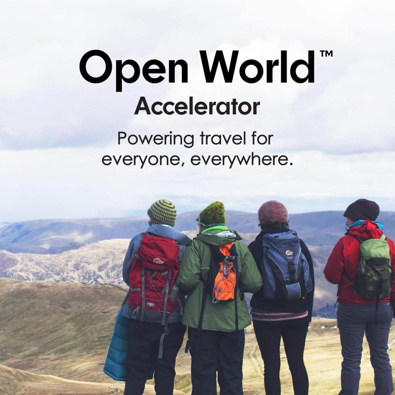 Four people in hiking gear looking at a panoramic view. "Open World Accelerator Powering travel for everyone, everywhere."