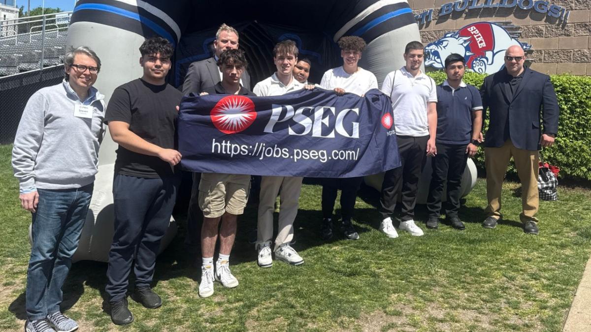 people holding a PSEG banner