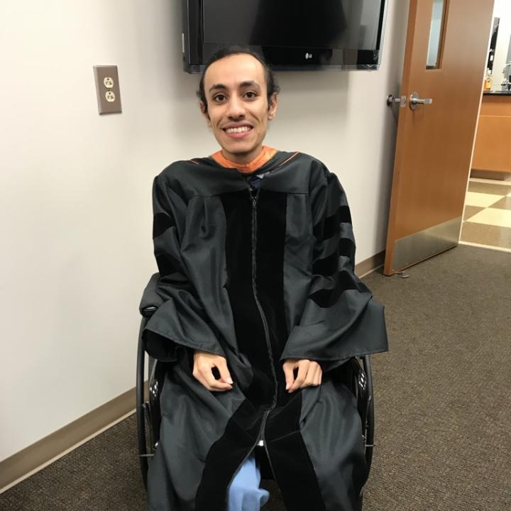 Peter Mansour in a graduation gown.