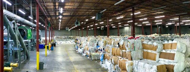 A warehouse full of bales of plastics