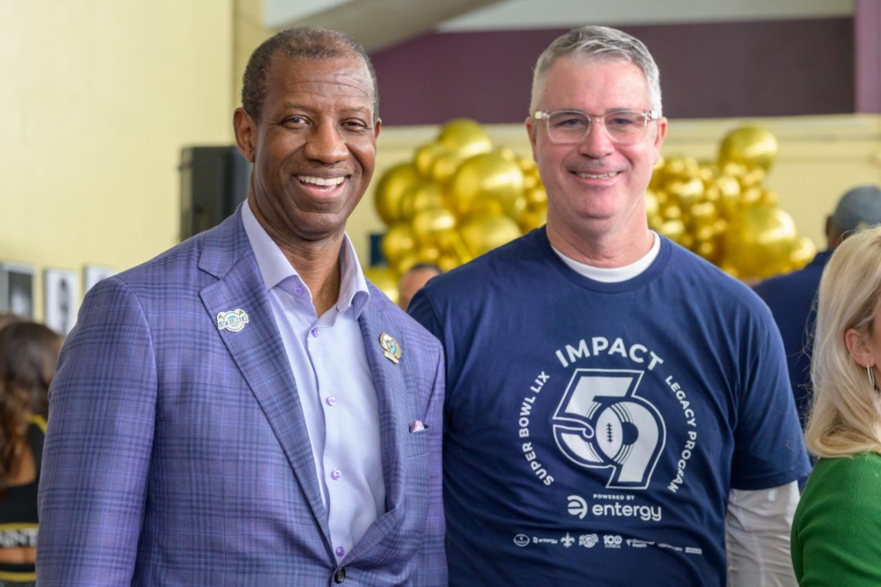 two people standing together and smiling