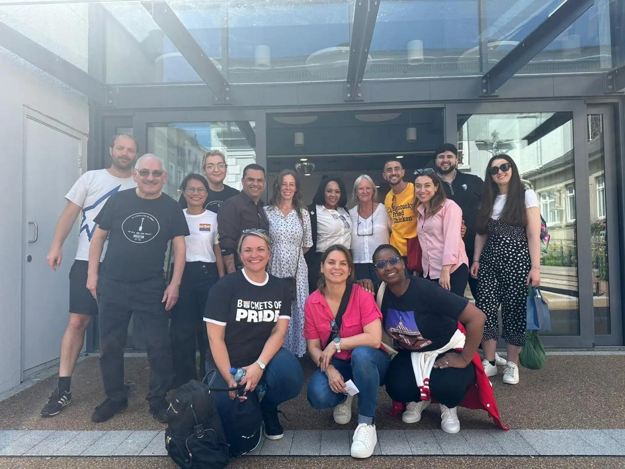 A team of people posed outside