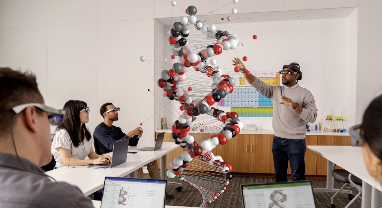 people wearing VR headsets looking at a representation of a DNA strand