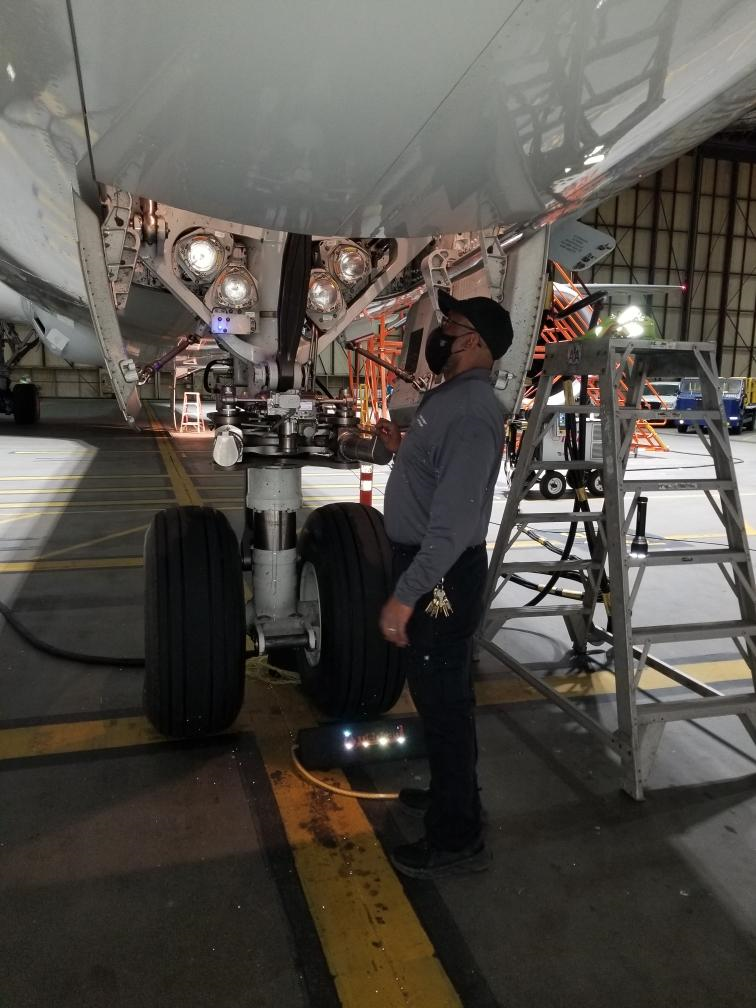 LAX Aviation Maintenance Technical Crew Chief, David Mansker examining a Boeing 787-9.