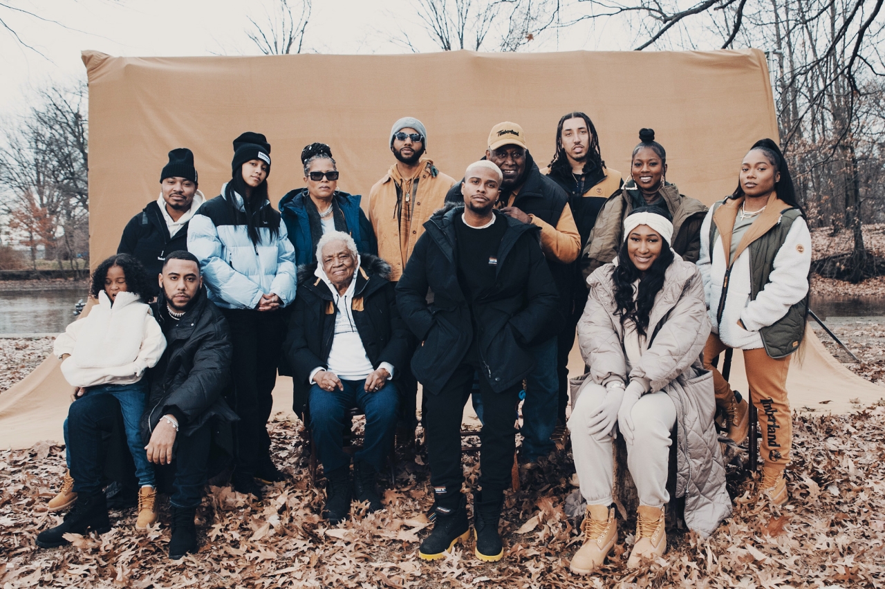 13 people posing in Timberland outfits