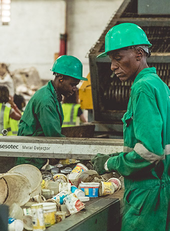 people sorting recycling 