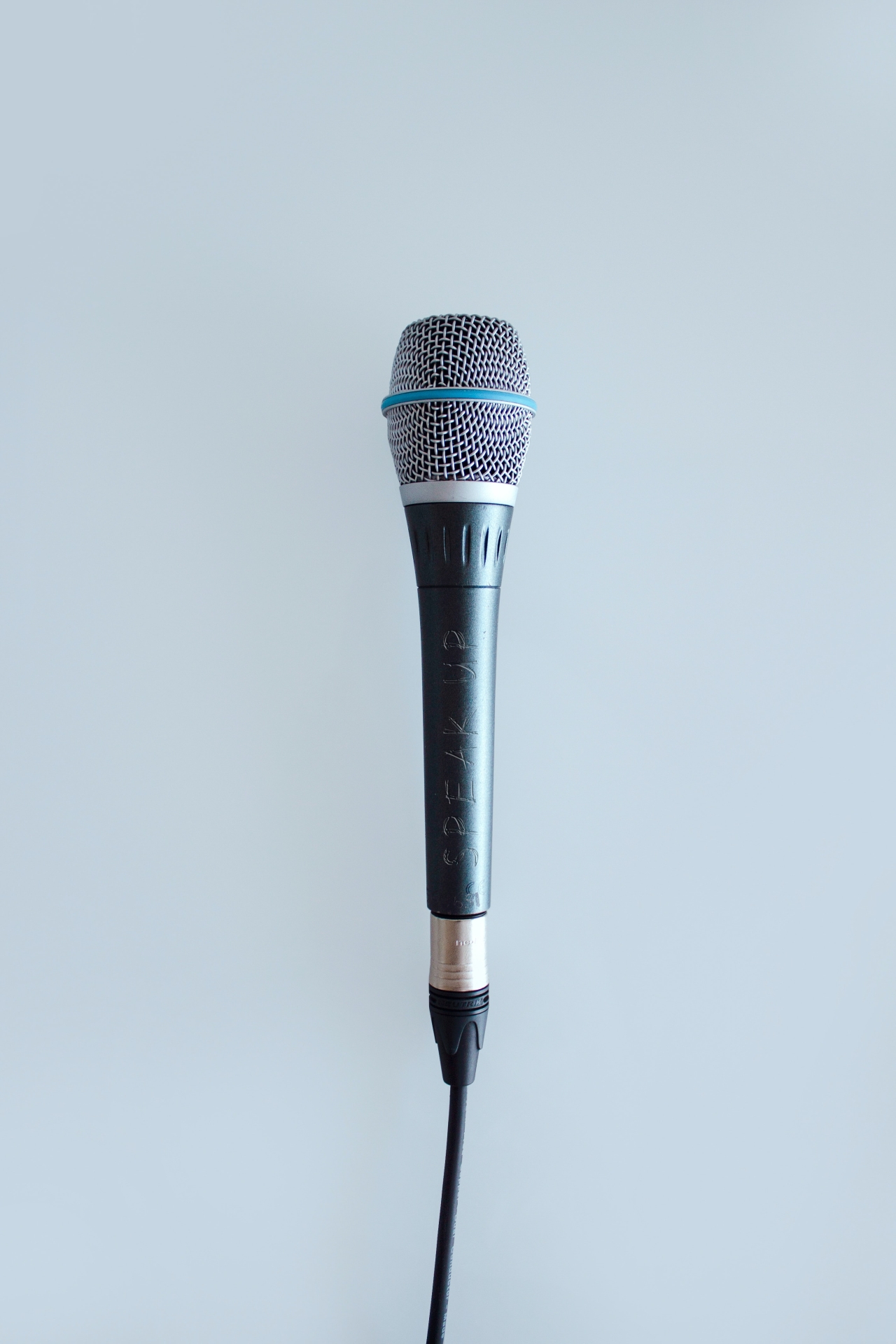 Microphone with 'speak up' etched in it