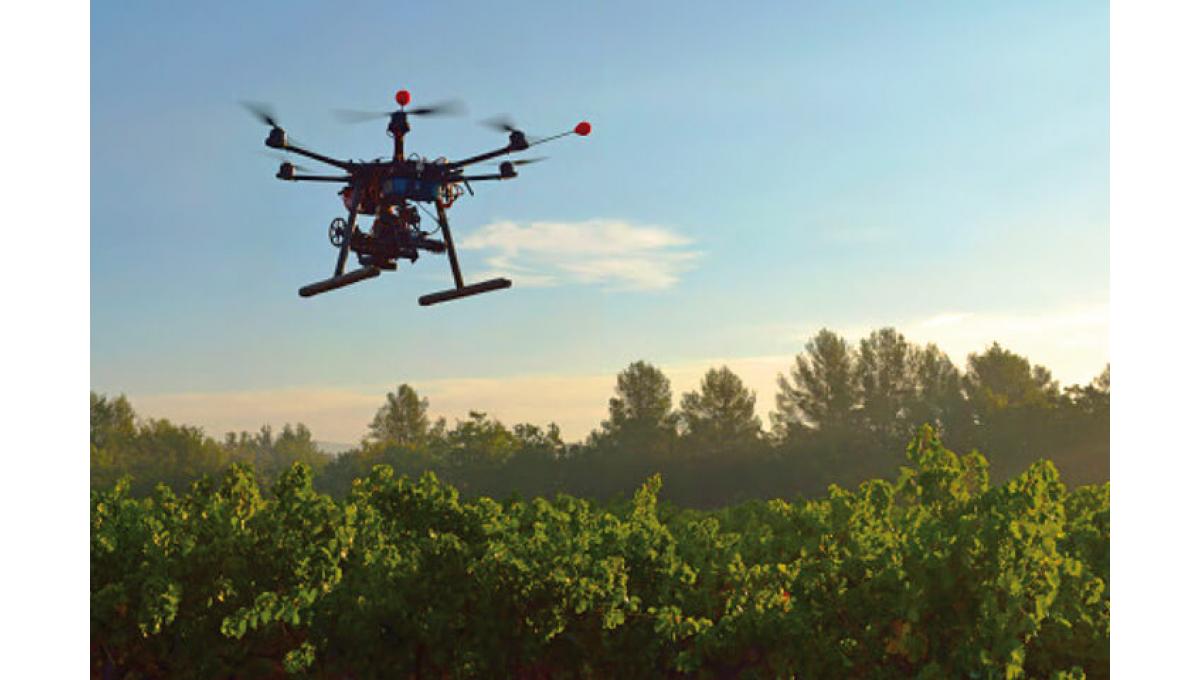 robot flying over crops