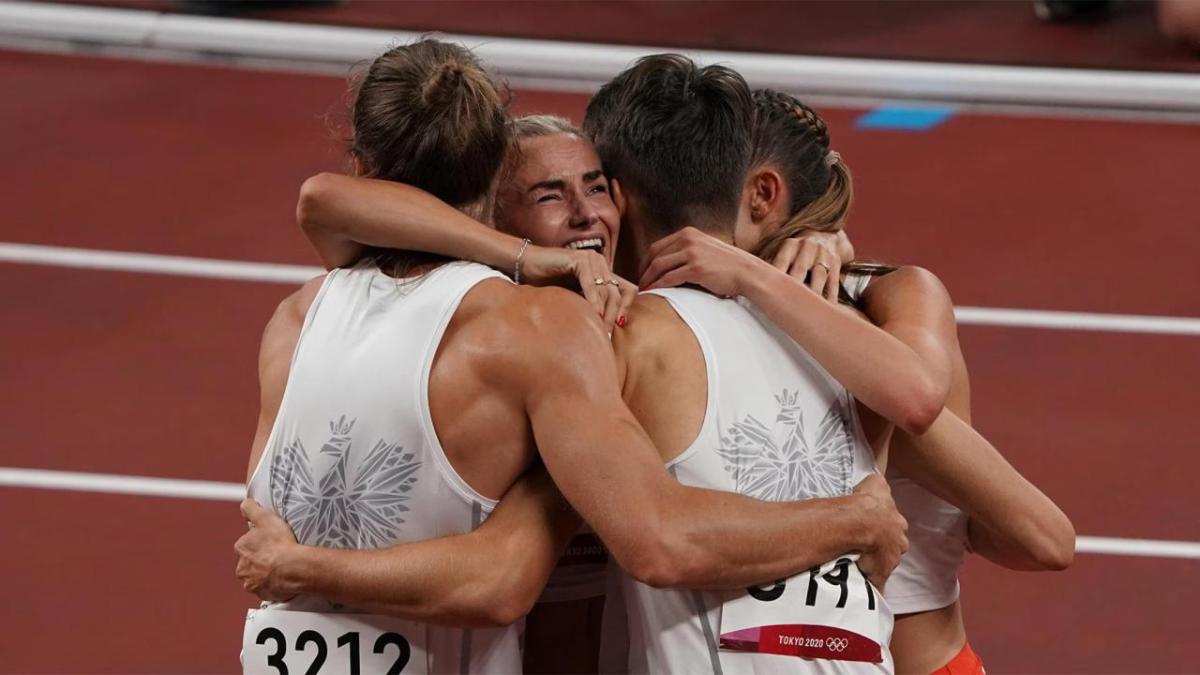 Runners hugging on the track