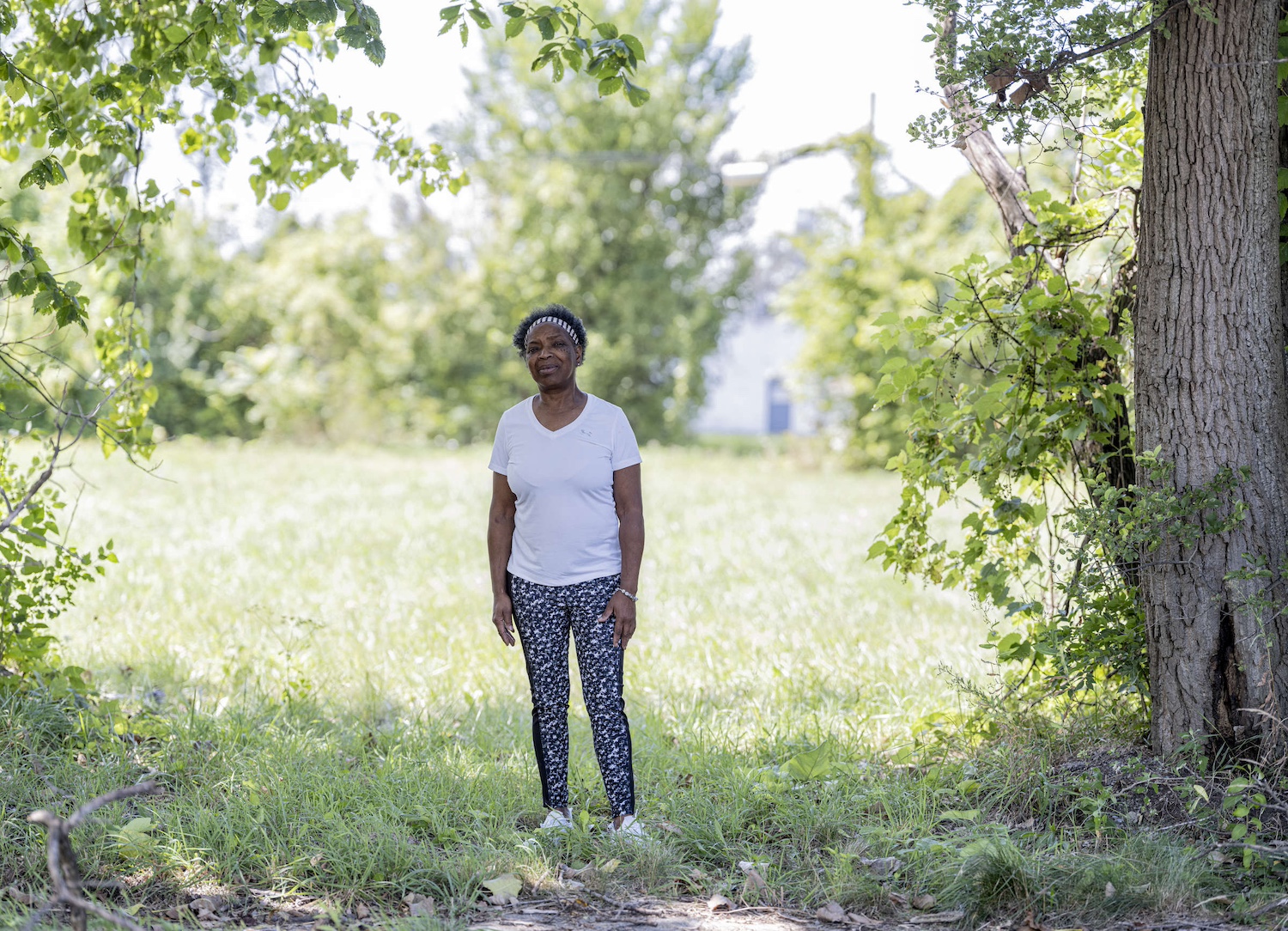 Sandra Turner-Handy stands in a grassy park — industrial air pollution