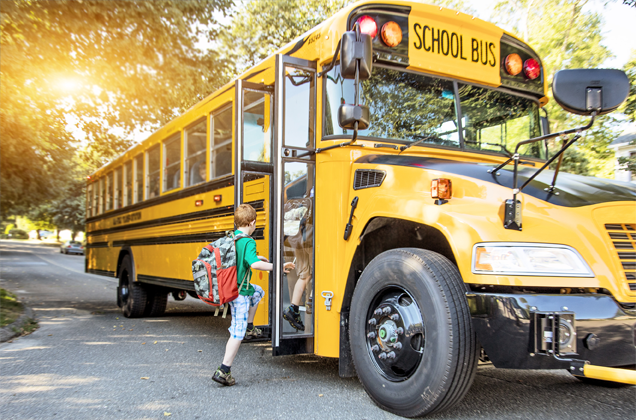 child entering a school bus