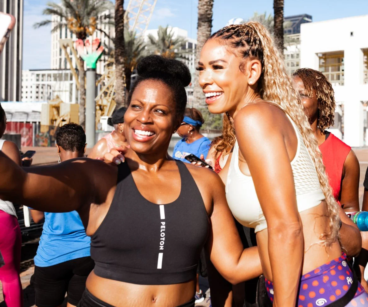 two people in exercise gear taking a selfie