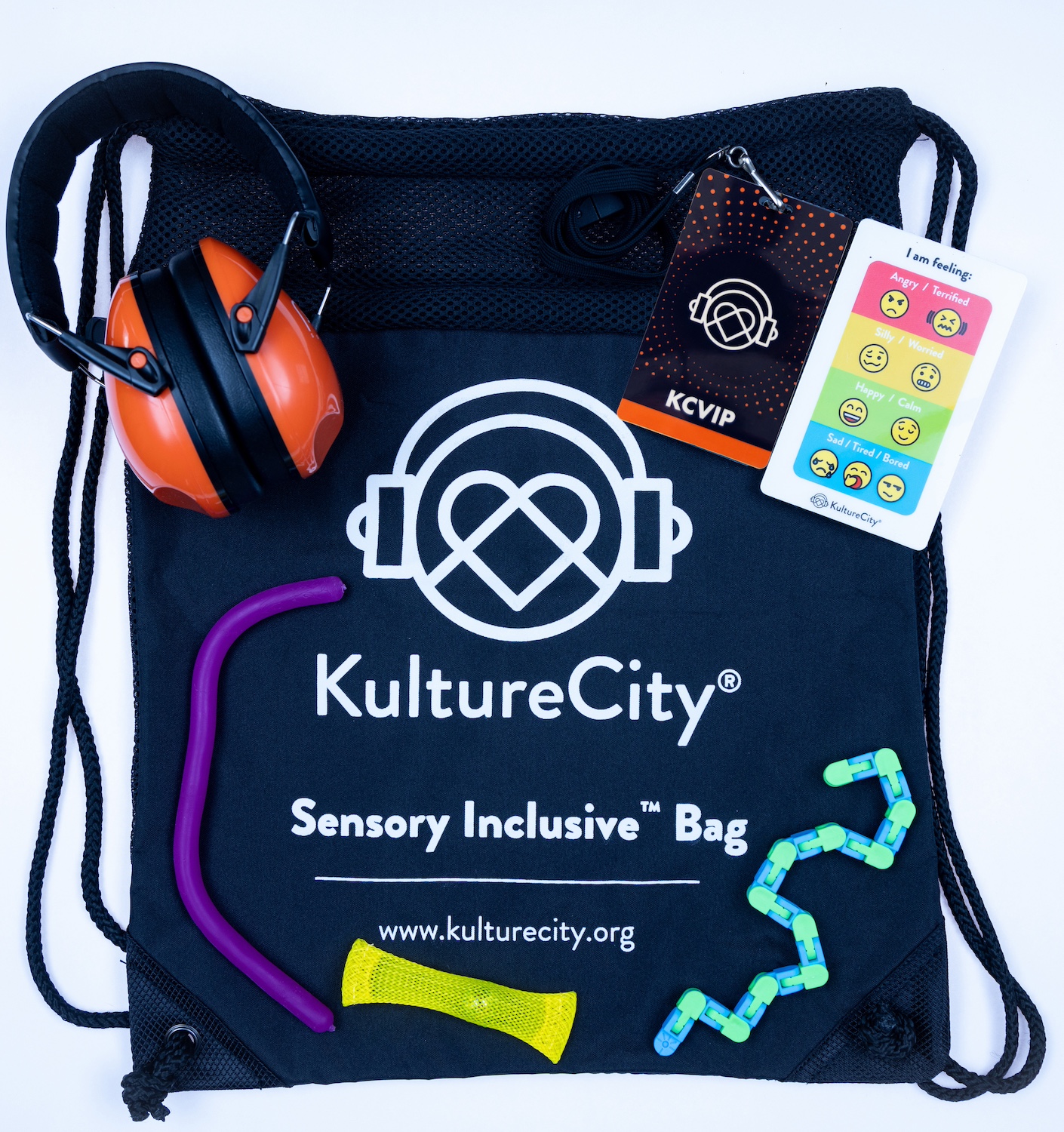The contents of the KultureCity sensory bags, including fidget toys, strobe reduction glasses, a communication cue-card depicting emotions, and noise-reduction headphones — sensory inclusive events