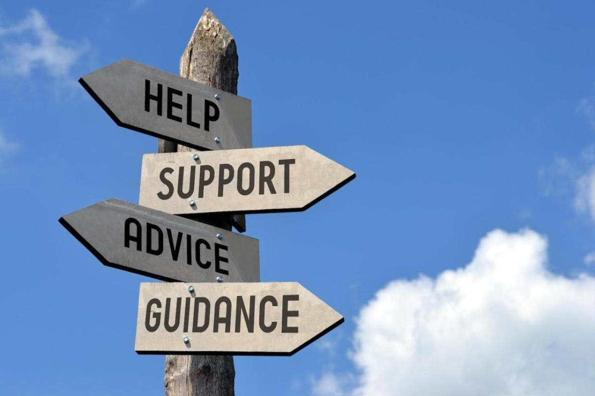 Signs with text "Help, Support, Advice, Guidance"