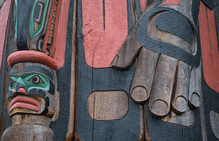 Detail of "Cedar Man Walking Out of the Log," a totem pole in Duncan, British Columbia. Carved by Gwe-la-y-gwe-la-gya-les (Richard Hunt), photo by Rex Wholster.