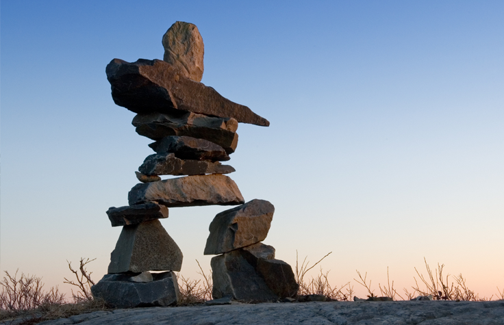 An inuksuk in Nova Scotia. These traditional travel markers serve as important cultural symbols for Inuit and other Indigenous Canadian peoples. Photo: Getty Images