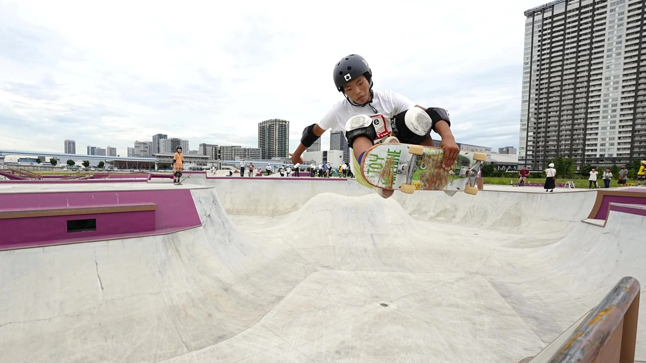 a child skate boarding in a skate park