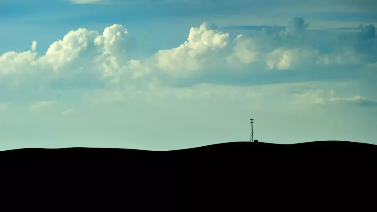 blue cloudy sky and land silhouette 