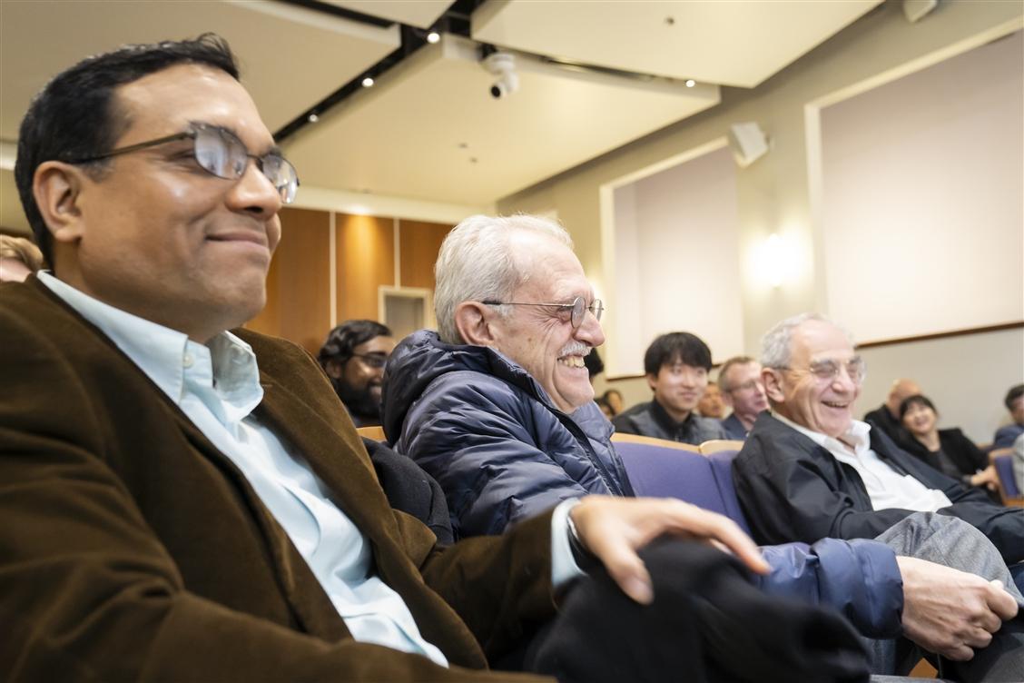 audience members smiling and laughing