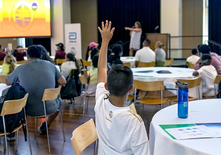 student raising their hand