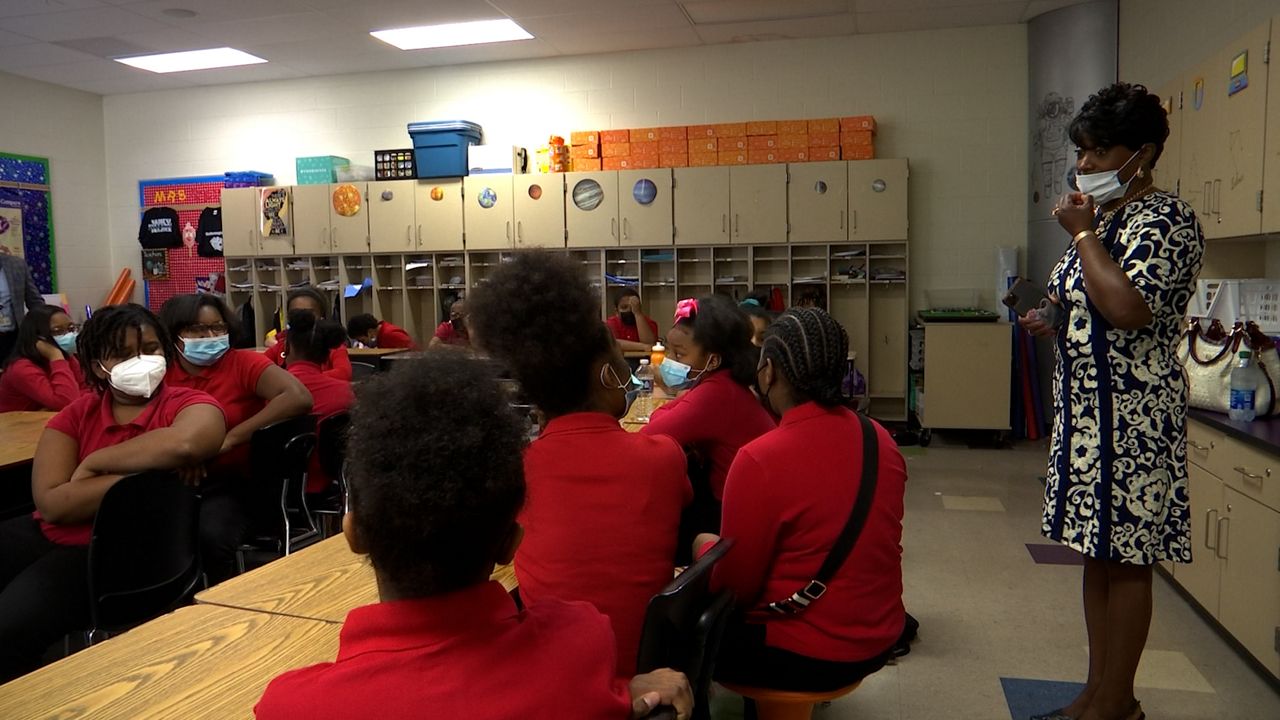 Cossey's classroom listens to Mcdonald speak. 