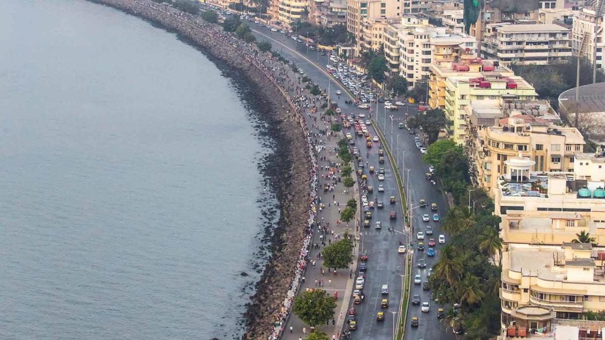 Aerial view of busy traffic and pedestrians along a coast
