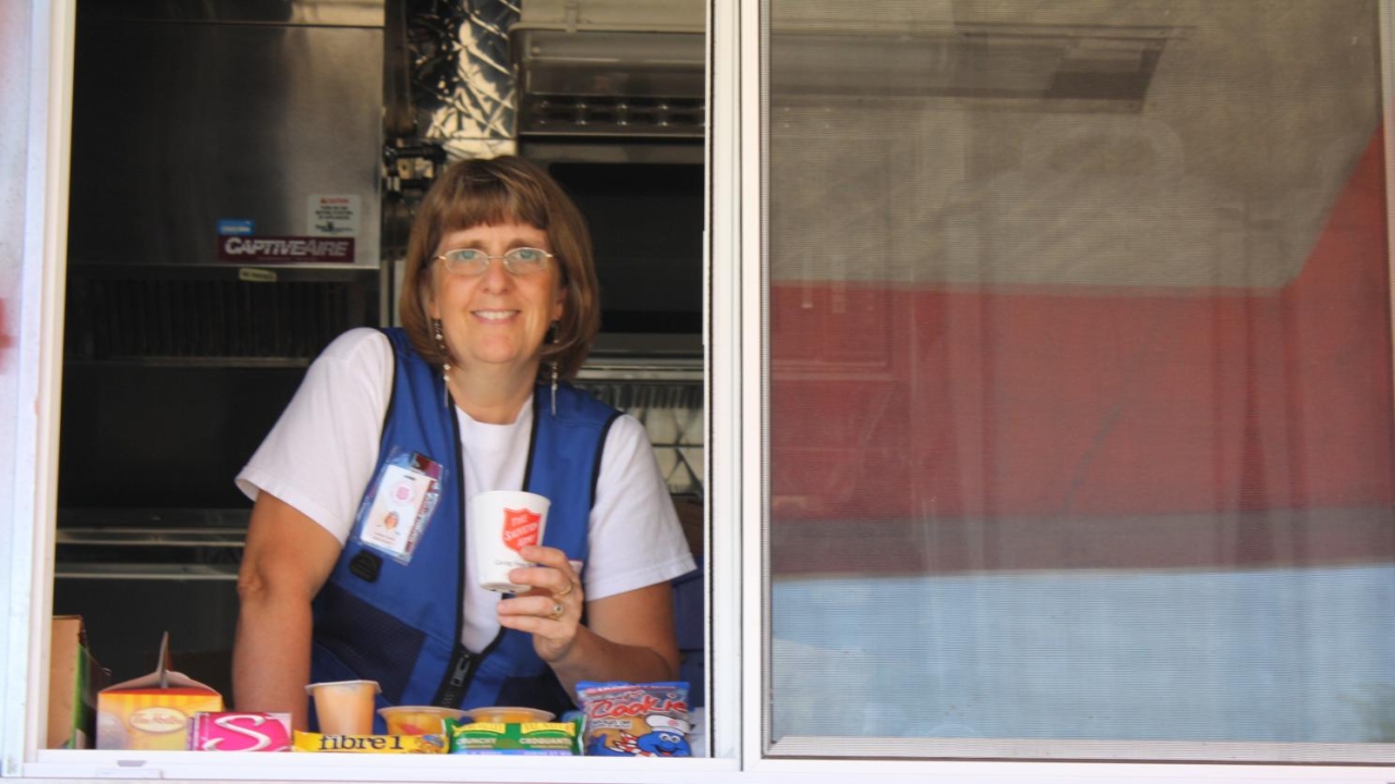 Debbie Clarke in the side service window of the CRU truck