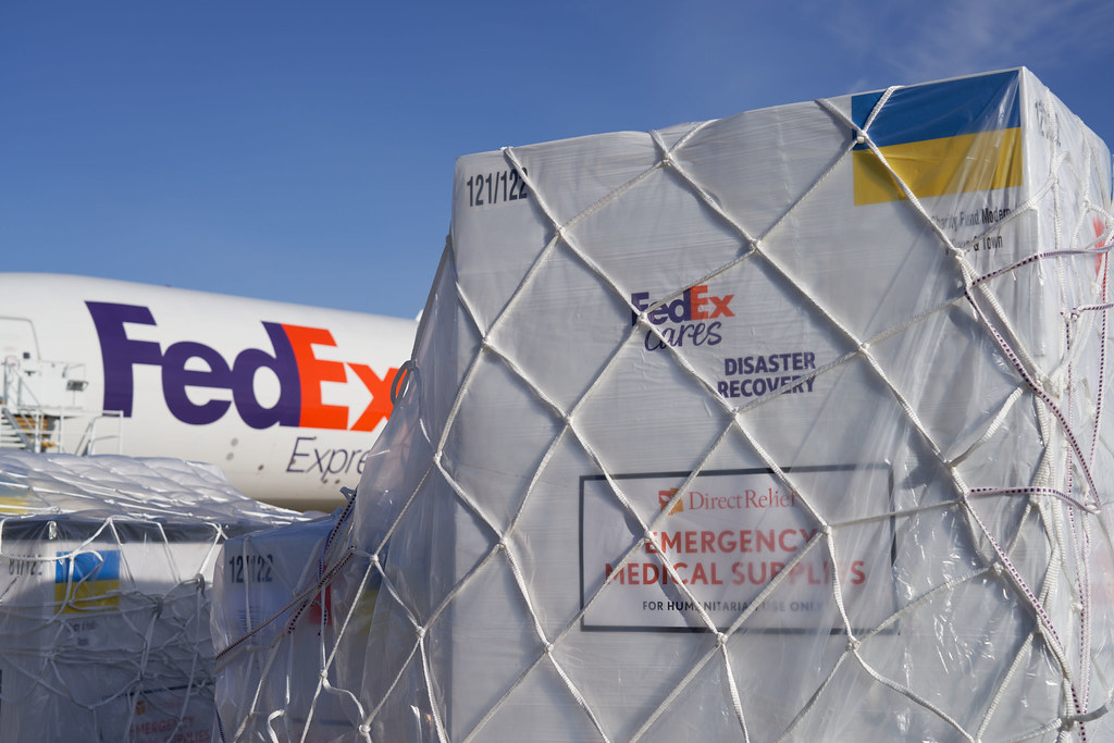 FedEx plane with cargo in front
