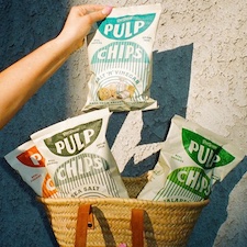 four bags of pulp chips in different flavors inside a woven bag