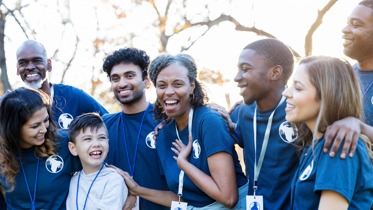 group of volunteers in blue t-shirts