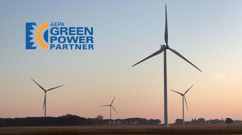 wind turbines at sunset, with Green Power partner logo