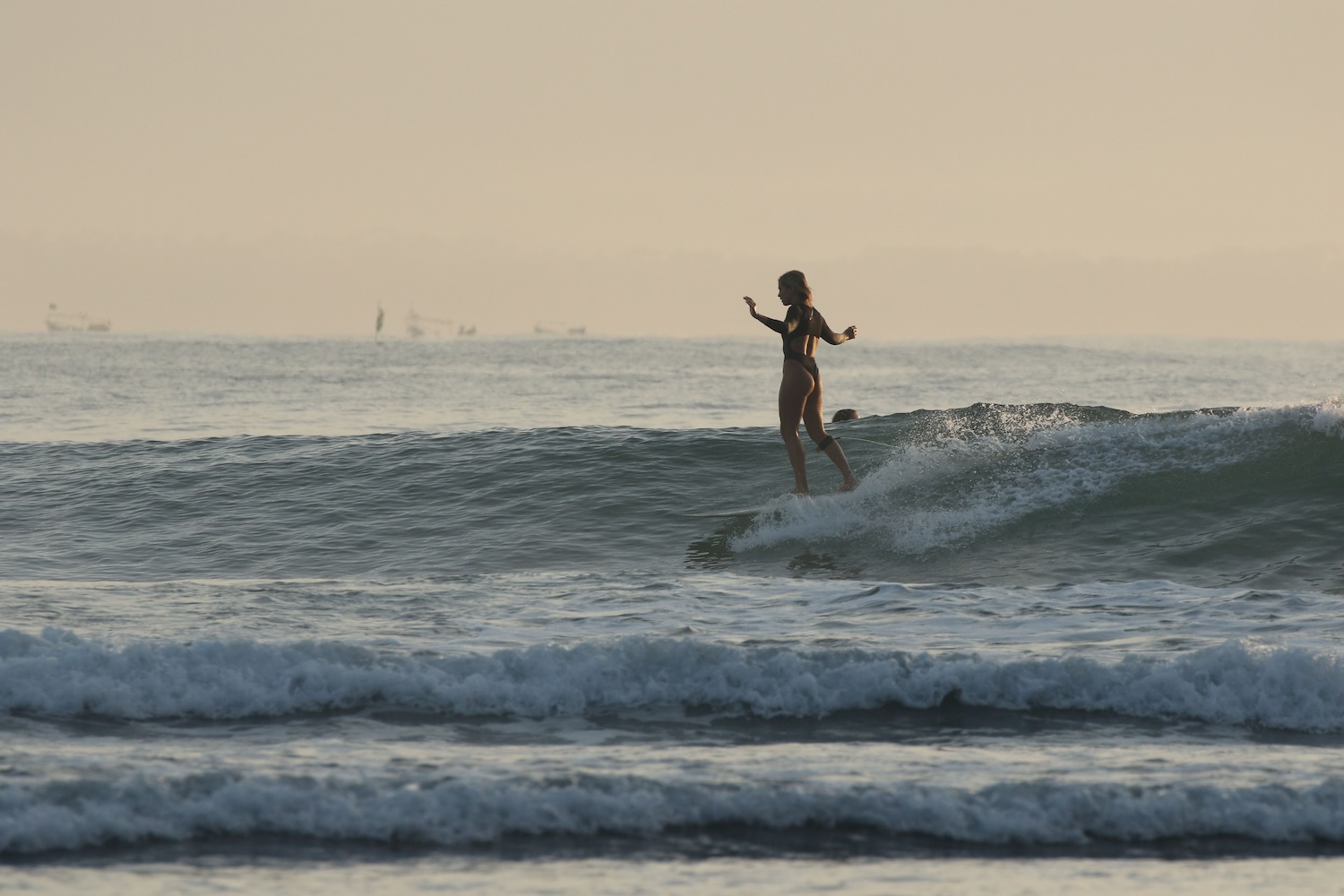 woman surfing in bali 