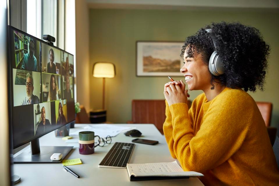 smiling employee at their desk