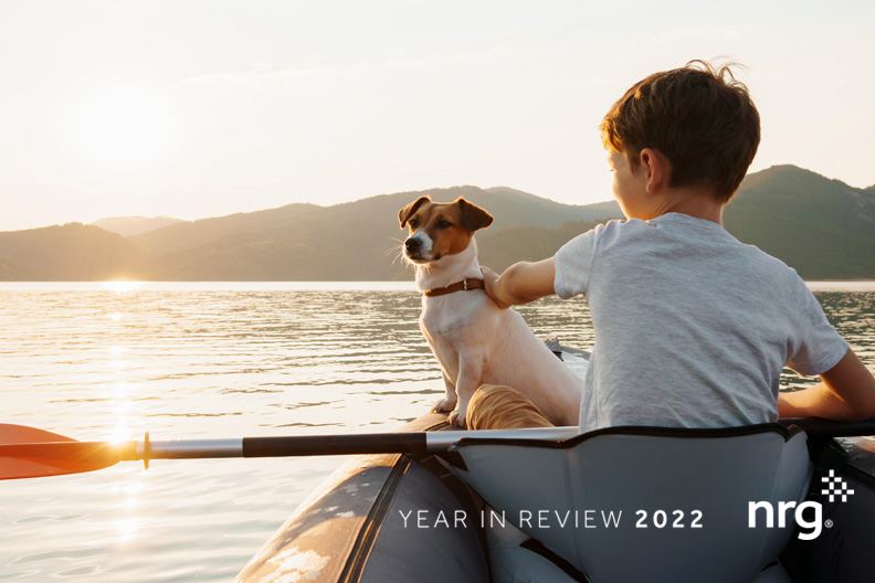 child and dog in kayak