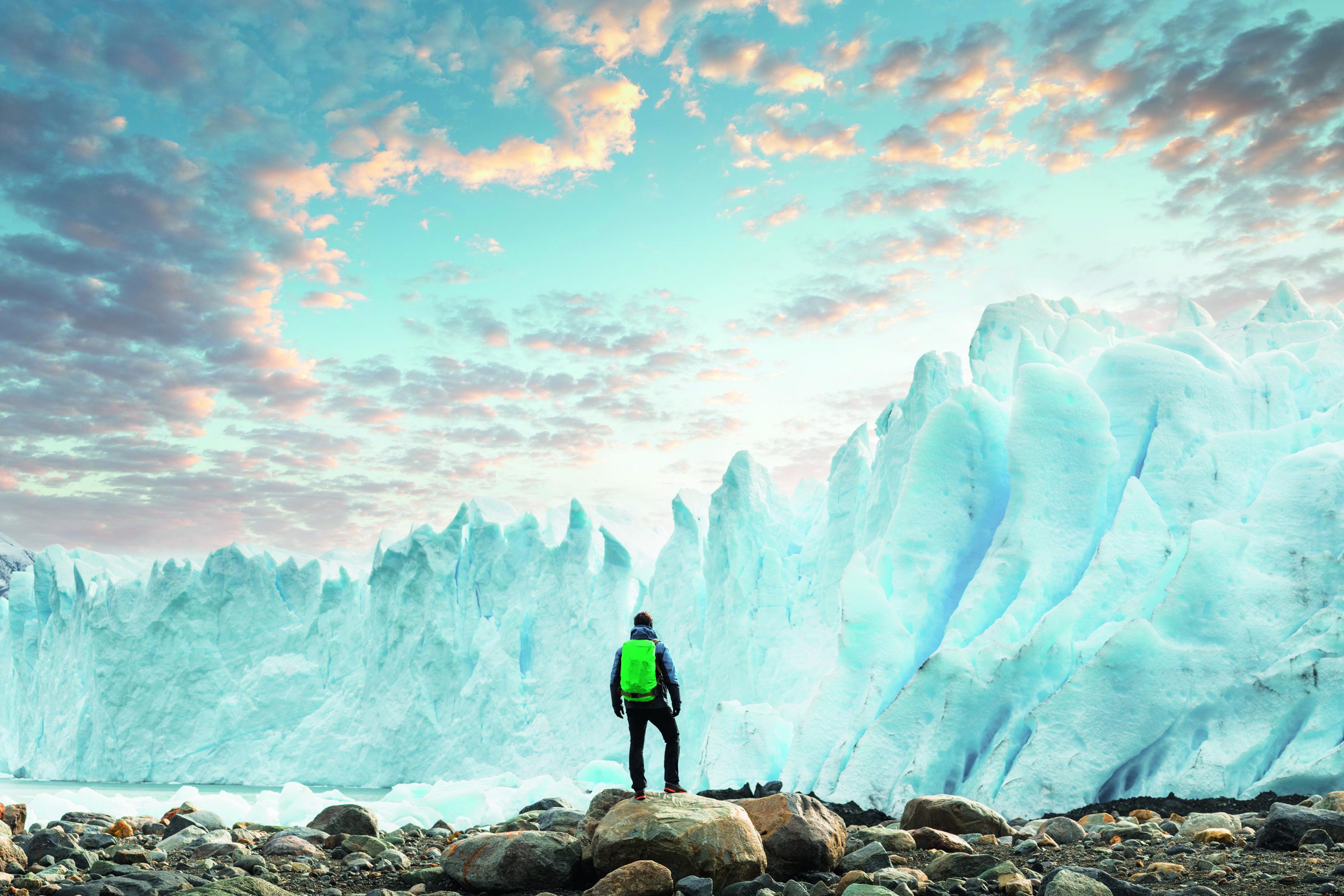 hiker looking at an iceberg