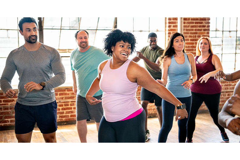Group of people doing aerobic exercise. 