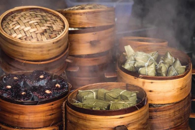 Steamer baskets filled with food 