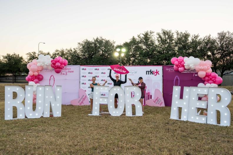 Sign reading &quot;RUN FOR HER&quot; 