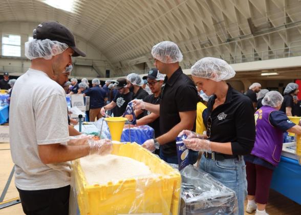 Volunteers from the LA Kings and Blue Shield of California gathered at the LAFD Frank Hotchkin Memorial Training Center to assemble meal kits for families in need.