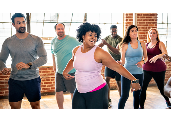 Group of people doing aerobic exercise.