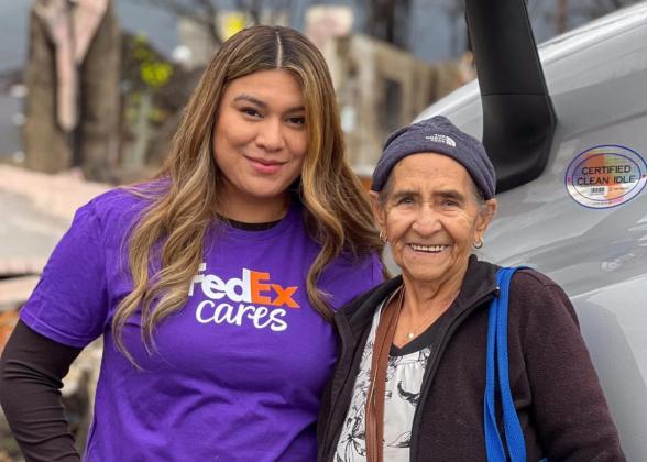 FedEx Cares volunteer with elderly woman