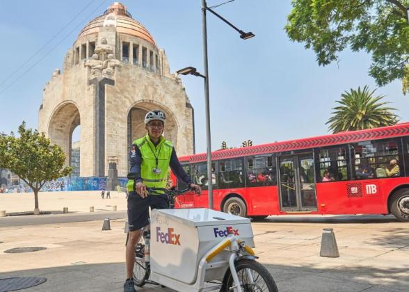 Person delivering for FedEx via bicycle