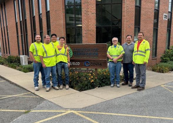 Workers standing outside of Elco Covia plant