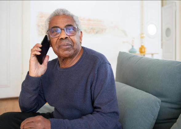 Older gentleman on the phone.