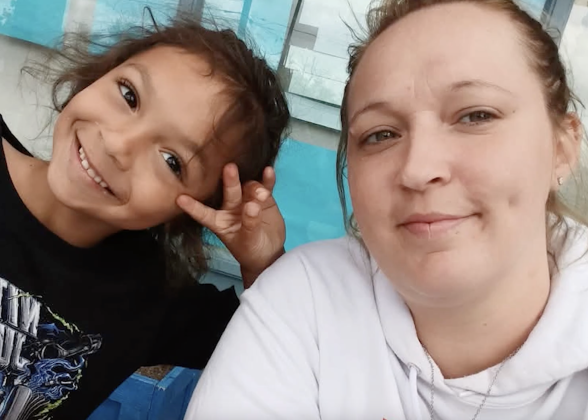 Smiling caregiver and child